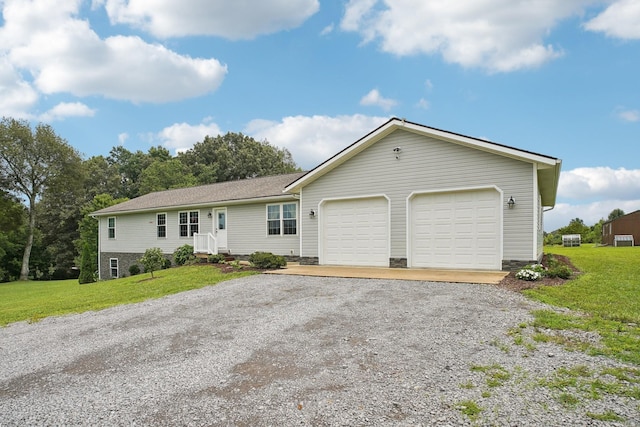 view of front of property with a garage and a front lawn