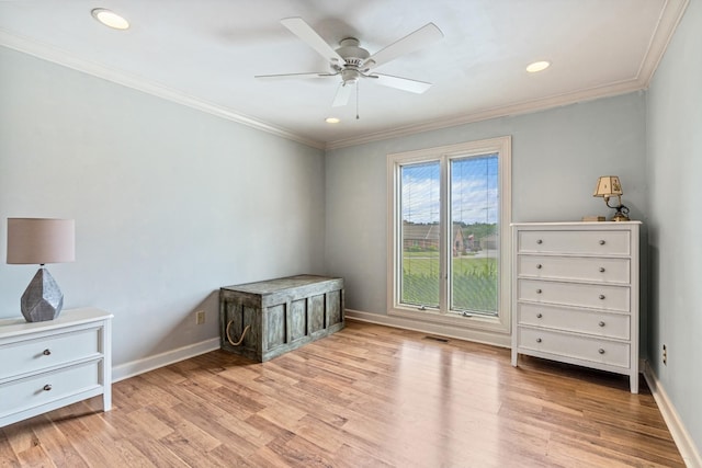 interior space with light hardwood / wood-style flooring, ceiling fan, and crown molding