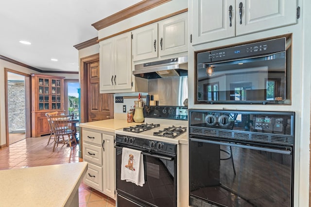 kitchen featuring white cabinets, crown molding, white gas range, light tile patterned floors, and black oven