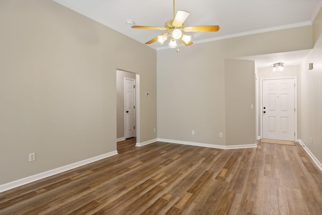 unfurnished room with hardwood / wood-style flooring, ceiling fan, and crown molding