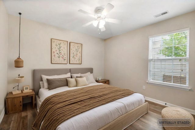 bedroom featuring ceiling fan and hardwood / wood-style flooring