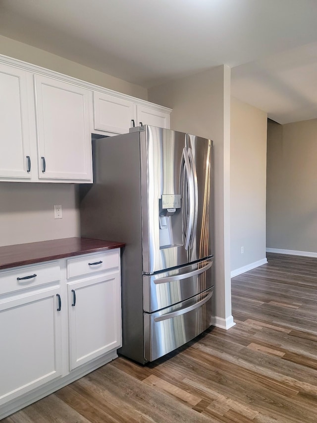 kitchen with white cabinetry, stainless steel fridge with ice dispenser, and dark hardwood / wood-style flooring