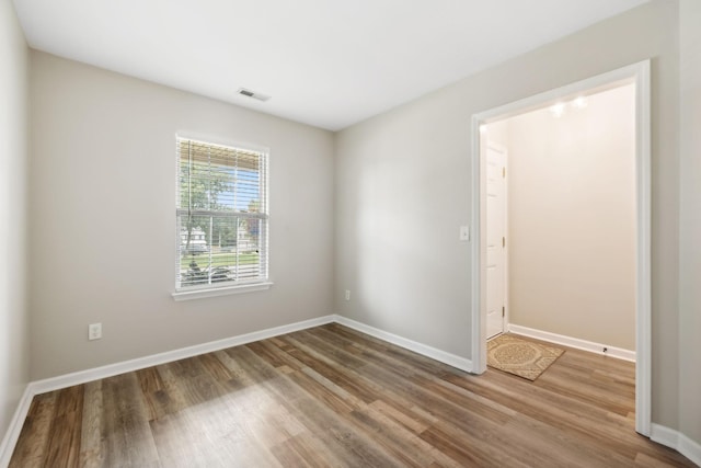 unfurnished room featuring wood-type flooring