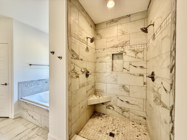 bathroom with separate shower and tub