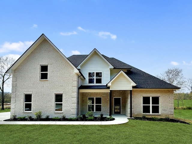 view of front of house featuring a front lawn and a porch