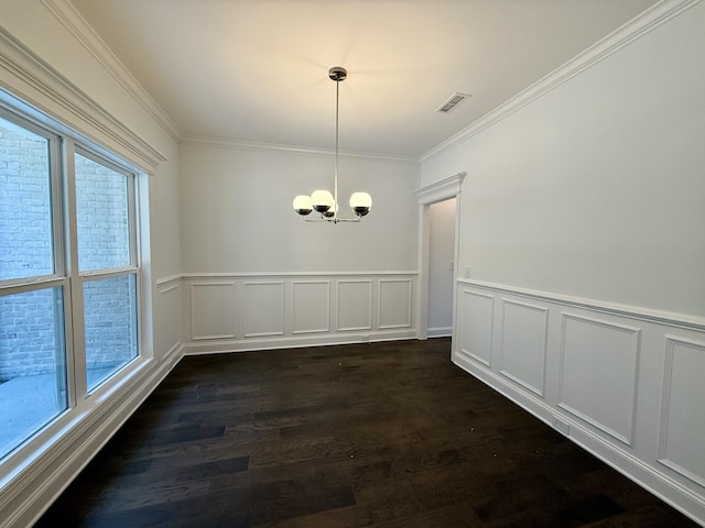 unfurnished dining area featuring a notable chandelier, dark hardwood / wood-style floors, and ornamental molding