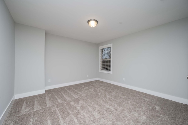 unfurnished room featuring carpet flooring