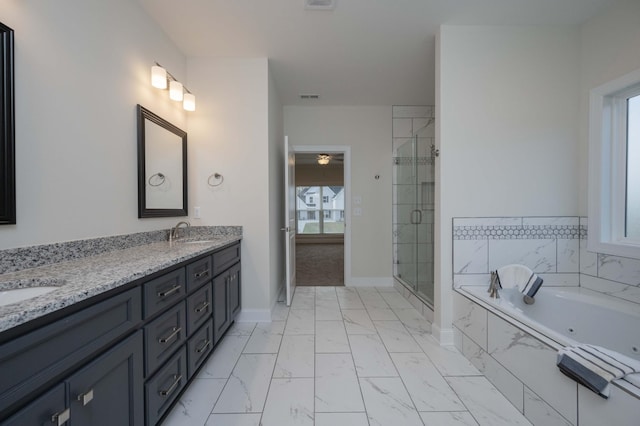 bathroom featuring vanity and plus walk in shower