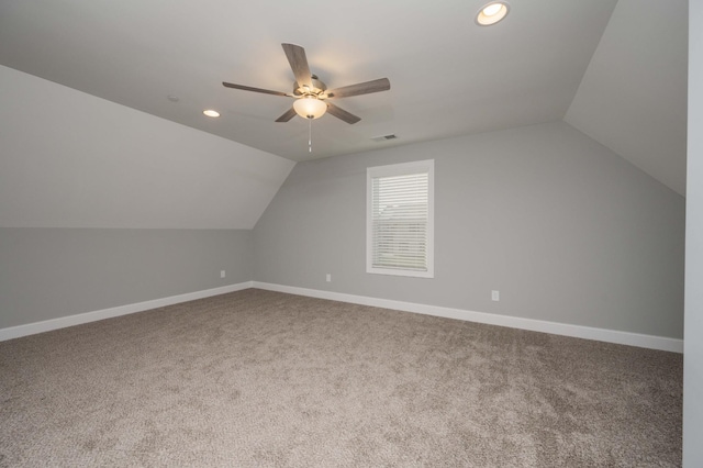 bonus room with carpet flooring, vaulted ceiling, and ceiling fan