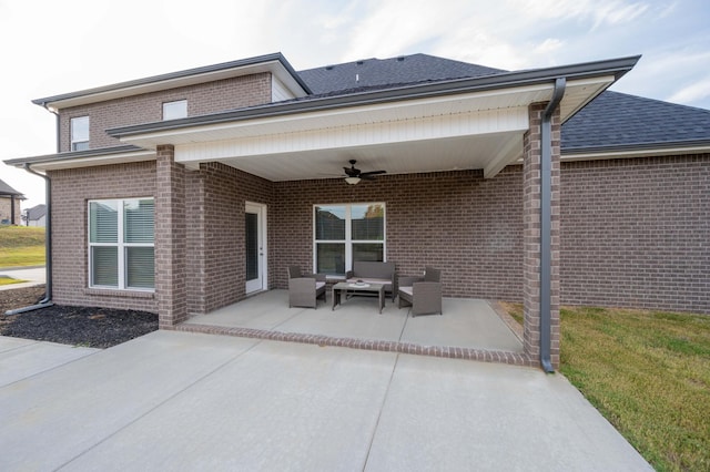 rear view of house with outdoor lounge area, ceiling fan, and a patio area