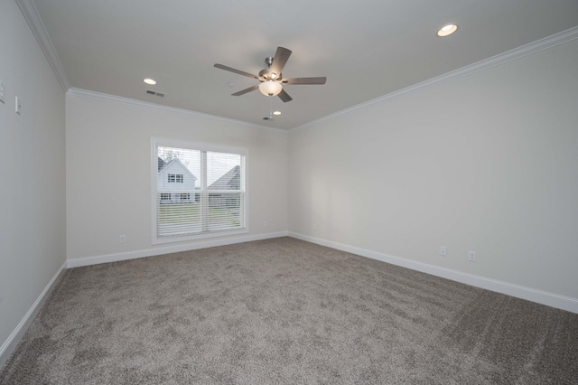 spare room with carpet flooring, ceiling fan, and ornamental molding