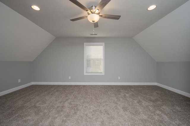 bonus room with carpet floors, vaulted ceiling, and ceiling fan