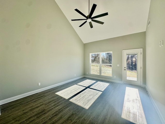 unfurnished room with ceiling fan, dark wood-type flooring, and high vaulted ceiling