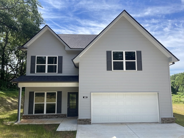 view of front facade with a porch and a garage