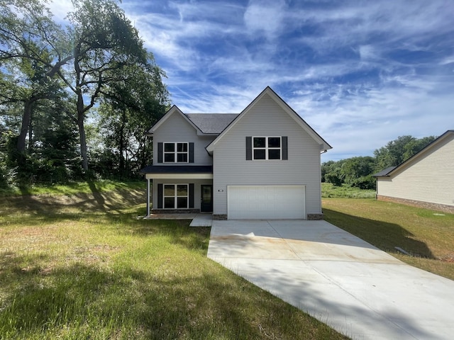 view of front of property featuring a garage and a front lawn