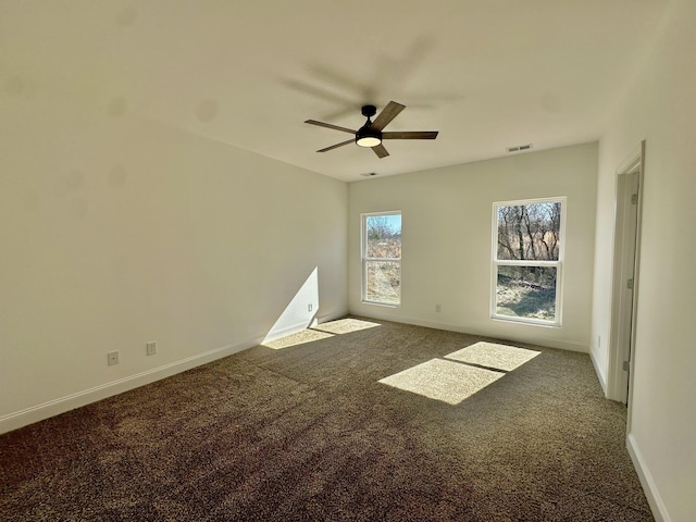 carpeted empty room featuring ceiling fan