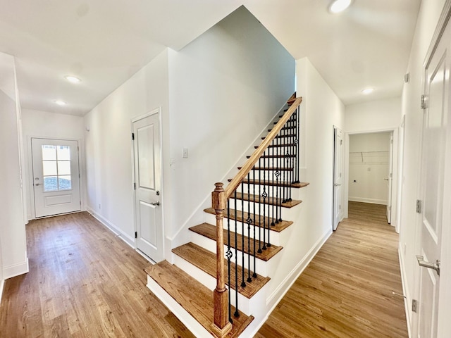 staircase with wood-type flooring