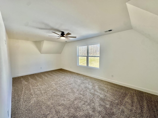 additional living space featuring carpet flooring, ceiling fan, and lofted ceiling