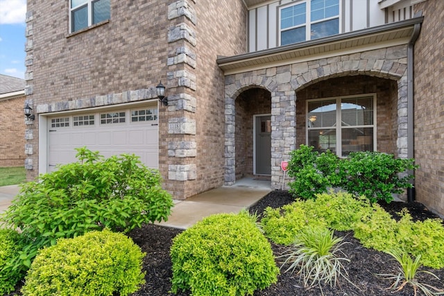 doorway to property featuring a garage