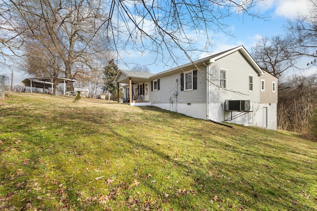 view of home's exterior featuring a lawn and central air condition unit