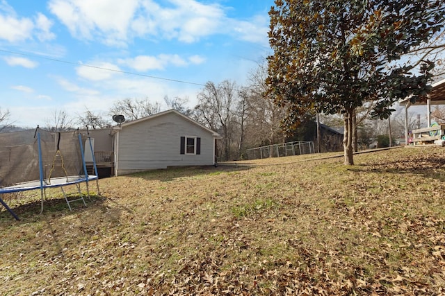 view of yard featuring a trampoline