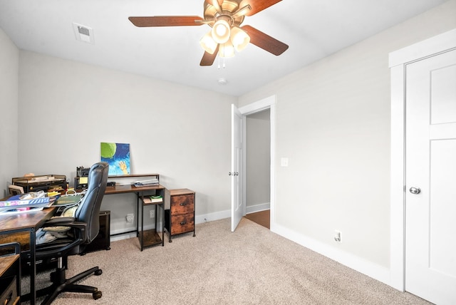 home office featuring ceiling fan and light colored carpet