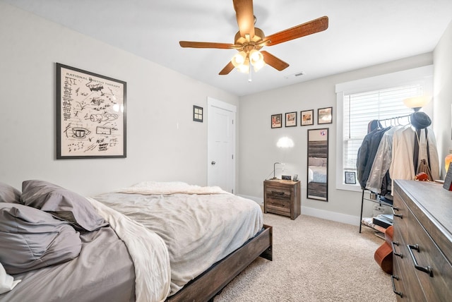 bedroom featuring ceiling fan and light colored carpet