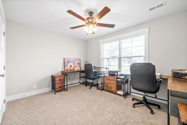 office space with ceiling fan and light colored carpet