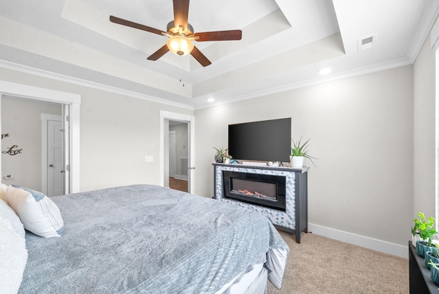 bedroom with light carpet, ceiling fan, ornamental molding, and a raised ceiling