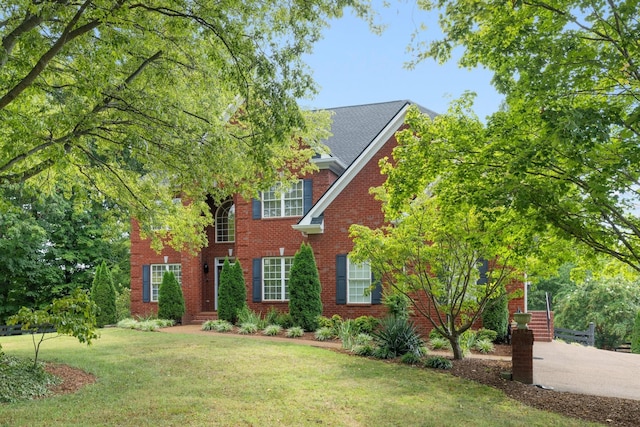 view of front of home with a front yard