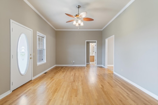 foyer with ceiling fan, light hardwood / wood-style floors, and crown molding