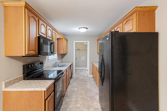 kitchen featuring sink and black appliances