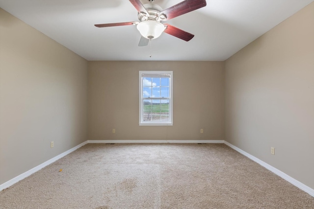 carpeted empty room with ceiling fan