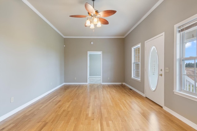 entrance foyer featuring ceiling fan, light hardwood / wood-style floors, and ornamental molding