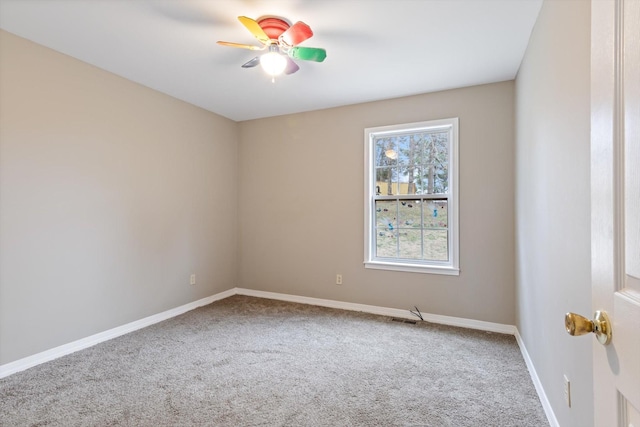 empty room with carpet flooring and ceiling fan