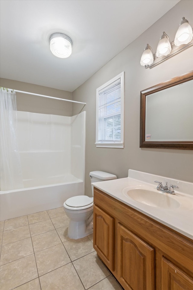 full bathroom featuring tile patterned flooring, vanity, toilet, and shower / bathtub combination with curtain