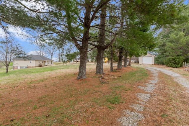 view of yard with a garage