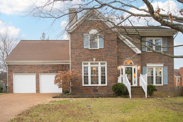 view of front of home with a garage and a front yard