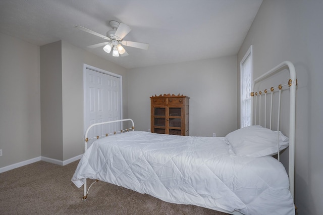 carpeted bedroom featuring ceiling fan and a closet