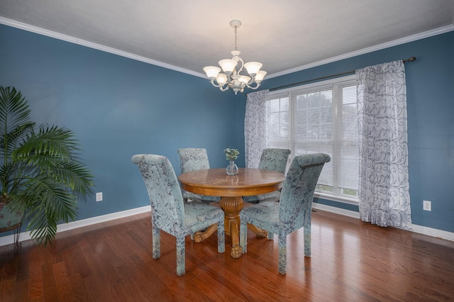 dining space with crown molding, dark hardwood / wood-style flooring, and a notable chandelier