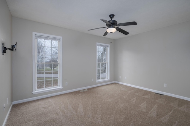 empty room with carpet and ceiling fan