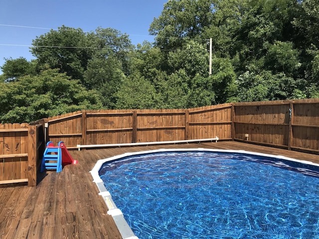 view of pool featuring a wooden deck