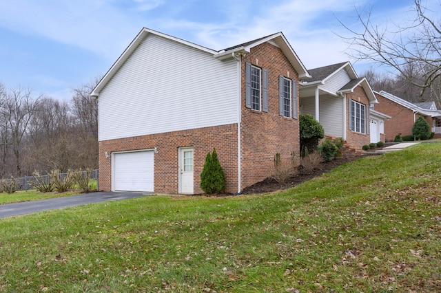 view of property exterior featuring a yard and a garage