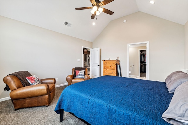 carpeted bedroom with ensuite bathroom, ceiling fan, and lofted ceiling