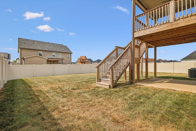 view of yard featuring a patio, central AC, and a wooden deck