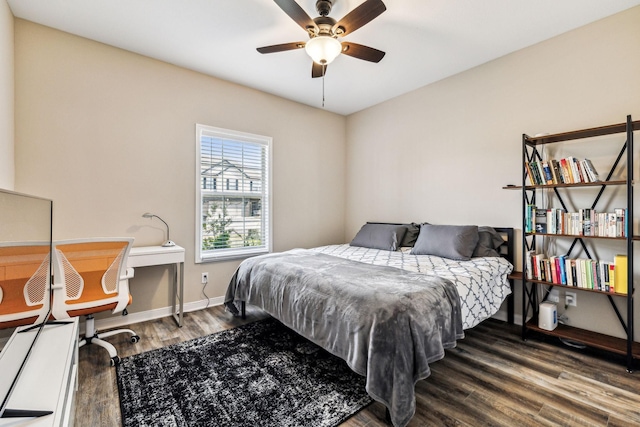 bedroom with hardwood / wood-style floors and ceiling fan