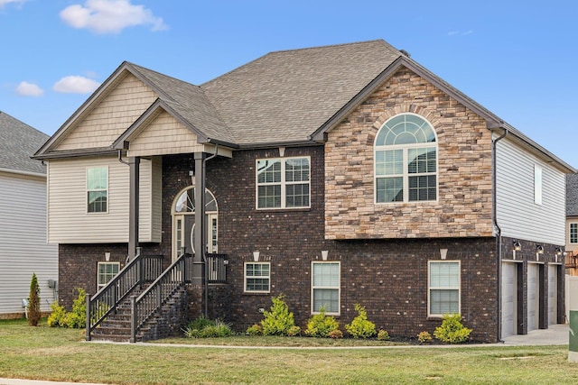 view of front of property with a front lawn and a garage