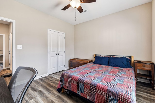 bedroom with a closet, ceiling fan, and dark hardwood / wood-style floors