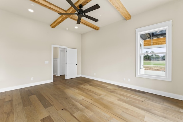 unfurnished bedroom with beam ceiling, light hardwood / wood-style flooring, and ceiling fan