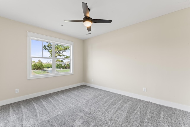 spare room featuring carpet flooring and ceiling fan